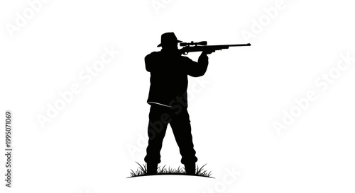 Silhouette of a hunter aiming a rifle in a grassy field