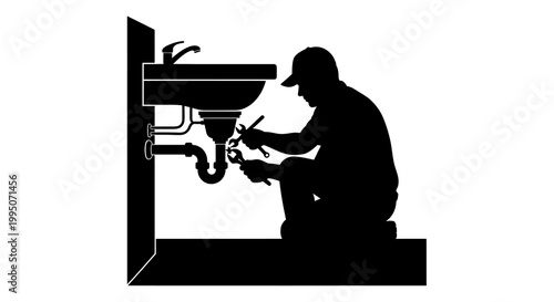 Silhouette of a plumber repairing pipes under a bathroom sink