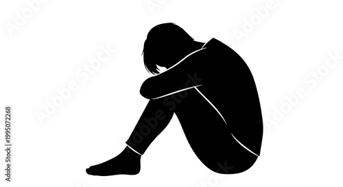 Silhouette of a person curled up in a seated despondent pose