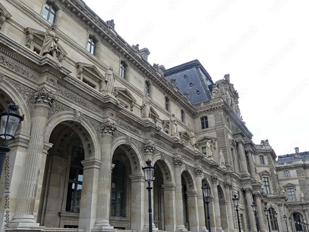 Obraz premium Paris, April 2026 : Visit of the magnificent city of Paris, Capital of France - View on different facades of buildings built by Baron Haussmann