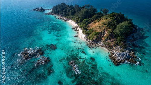 Aerial drone photography of Koh Lipe, Satun, Thailand, showing emerald green and blue crystal-clear waters, lush green mountains, rich nature, and the Andaman Sea.