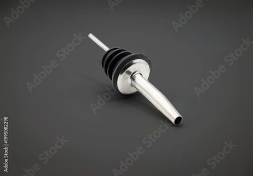 Speed ​​Pourer for bottles close-up on a gray background