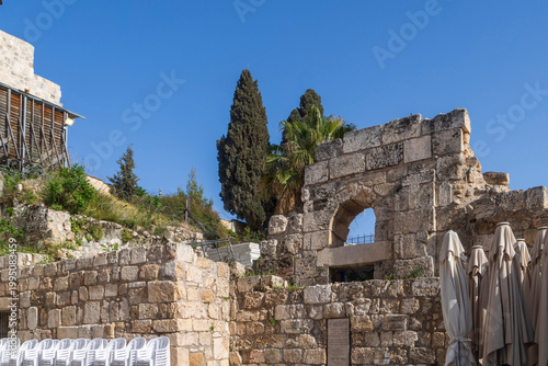 Jerusalem, Israel, April 17, 2026, ancient stone ruins and walls under a clear blue sky in Jerusalem.  Church of the Holy Sepulchre next to it