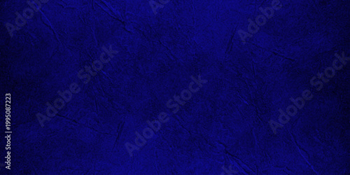Abstract Deep Blue and Black Grungy Textured Background with Subtle Distressed Paint Splatter and Cinematic Dark Mood. aged metal, stone, or atmospheric smoke. deep cobalt blue and black color palette