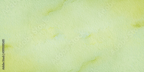 Pale lime green and cream watercolor wash texture on cold press paper with organic edges. A soft, abstract watercolor painting featuring light lime green and pale yellow pigments bleeding into white