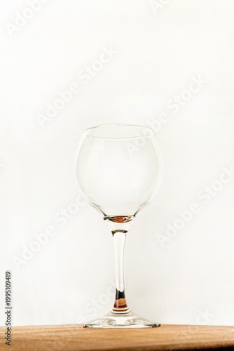 Wine glass, wine glass on rustic wooden surface and white background, selective focus.