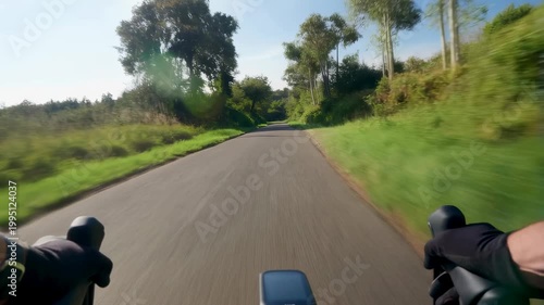 Biking through scenic countryside on a sunny day. Experience the thrill of cycling in nature, promoting outdoor adventure and fitness