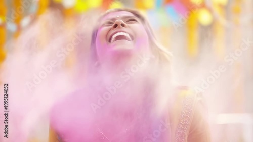 Joyful woman celebrating Holi festival with vibrant colors and laughter. A representation of cultural festivities and the spirit of togetherness