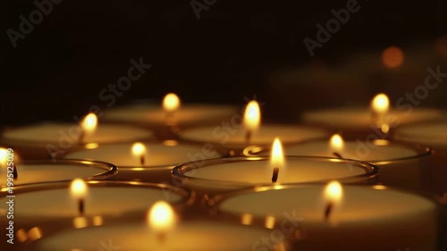 Close-up of flickering candles in a serene setting. Ideal for creating a calming atmosphere and enhancing relaxation