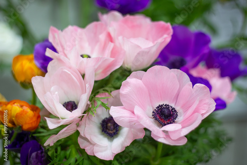 Colorful floral bouquet with pink anemones and ranunculus