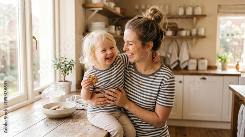 preparation of family breakfast. mother and child son cut bread  and eat cookies with milk in morning