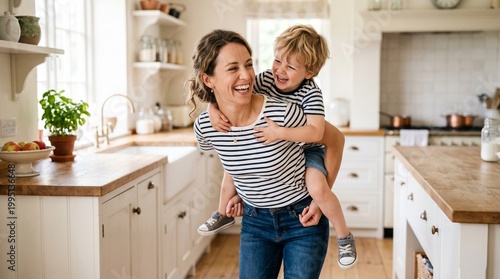 preparation of family breakfast. mother and child son cut bread  and eat cookies with milk in morning.