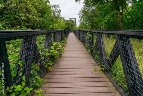 The Tur Viewing Platform at Cuningar Loop, Scotland, UK, is a landmark viewing platform and lookout tower providing elevated, treetop views across the woodland park, the River Clyde, the Hope statue. 