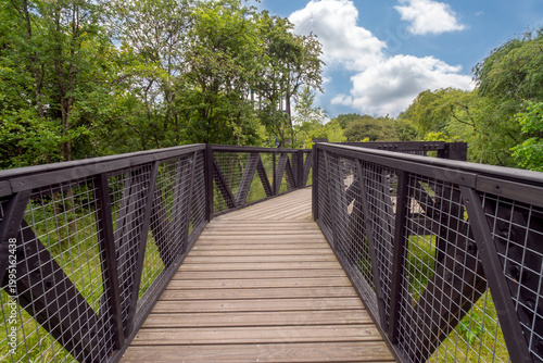 The Tur Viewing Platform at Cuningar Loop, Scotland, UK, is a landmark viewing platform and lookout tower providing elevated, treetop views across the woodland park, the River Clyde, the Hope statue. 