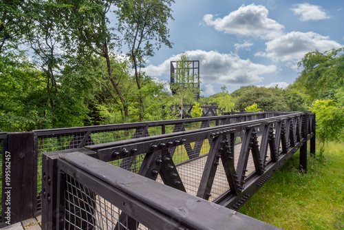 The Tur Viewing Platform at Cuningar Loop, Scotland, UK, is a landmark viewing platform and lookout tower providing elevated, treetop views across the woodland park, the River Clyde, the Hope statue. 