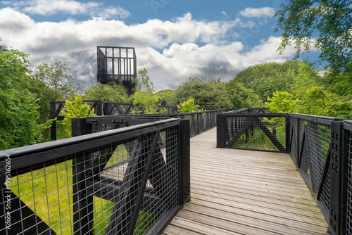 The Tur Viewing Platform at Cuningar Loop, Scotland, UK, is a landmark viewing platform and lookout tower providing elevated, treetop views across the woodland park, the River Clyde, the Hope statue. 