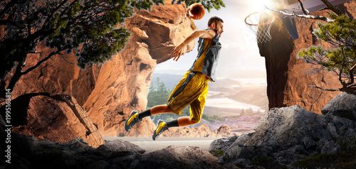 Basketball. A basketball player practices on a basketball court in the wilderness. A beautiful landscape is in the background.