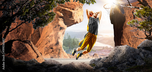 Basketball. A basketball player practices on a basketball court in the wilderness. A beautiful landscape is in the background.