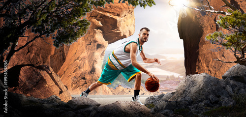 Basketball. A basketball player practices on a basketball court in the wilderness. A beautiful landscape is in the background.