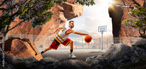 Basketball. A basketball player practices on a basketball court in the wilderness. A beautiful landscape is in the background.
