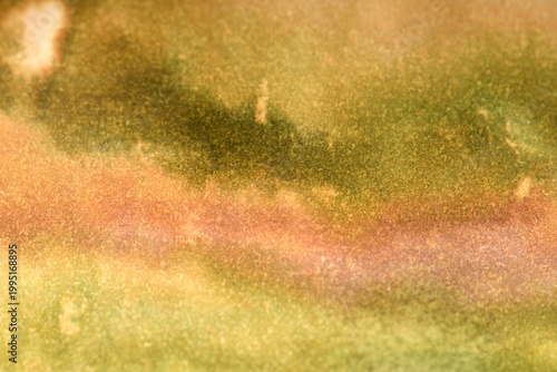 
Close-up art background of yellow stains on paper