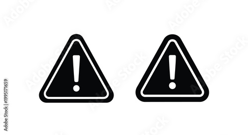 Two black warning signs with exclamation points a stark silhouette