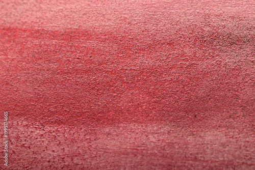 
Close-up of white paint strokes on red background