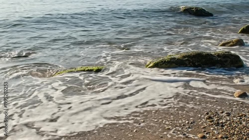 Waves Crashing on Rocky Beach Shore.