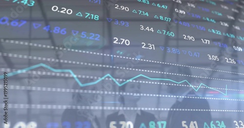 Displaying market panel on trading floor, showing cyan line, tickers, three suited people observing