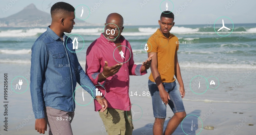 Fototapeta premium Walking trio wearing denim jacket, magenta shirt, mustard polo on sandy shoreline, showing CO2 HUD