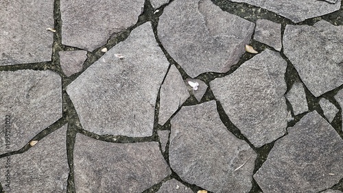 Cuadro en lienzo Top view of grey irregular stone pavement texture