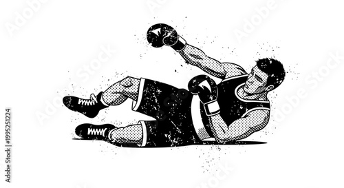 Boxer knocked down, lying on floor, wearing boxing gloves and shorts.