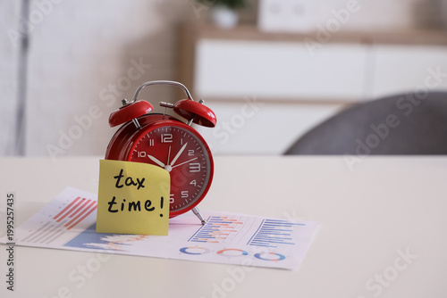 Alarm clock with text TAX T...