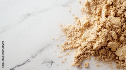 Fine Light Brown Powder on a Marble Surface for Culinary Use