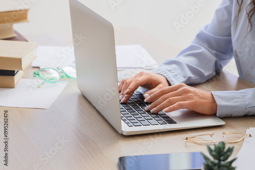 Female writer editing text ...