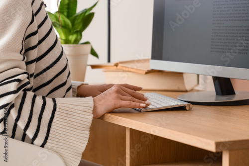 Female writer editing text ...