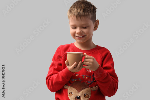 Cute little boy with cup of...