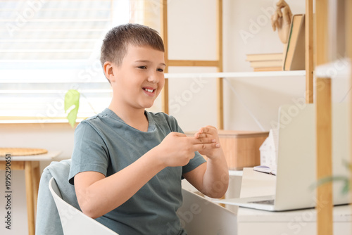 Mute boy using sign languag...
