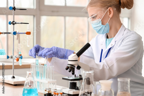 Female scientist with test ...