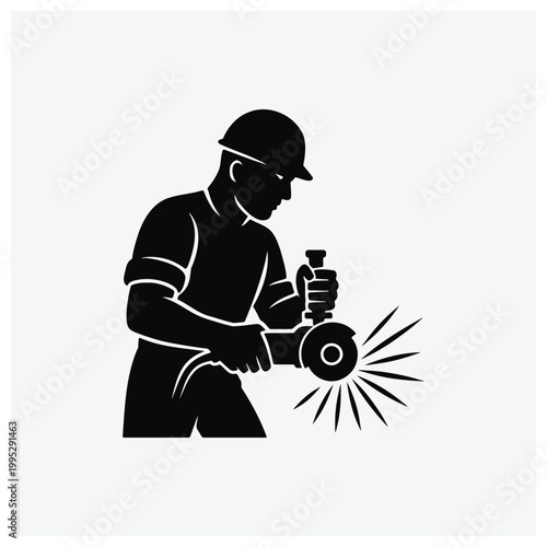 Silhouette of a worker welding with a torch, generating sparks