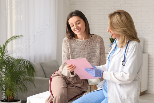Female doctor showing clipb...