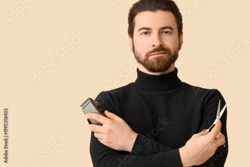 Bearded young man with elec...