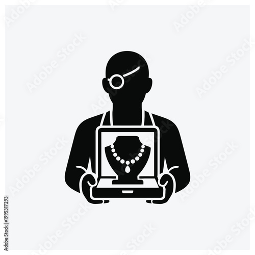 Silhouette of a jewelry seller displaying necklaces on a laptop.