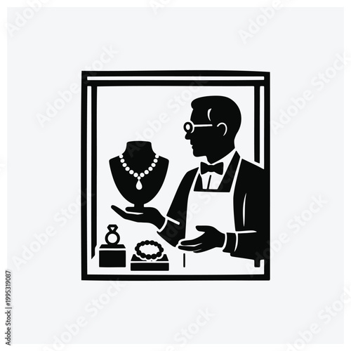 Silhouette of a jewelry store worker examining necklaces and rings