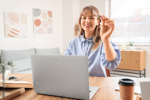 Young woman with hearing ai...