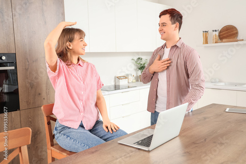 Young deaf mute couple usin...