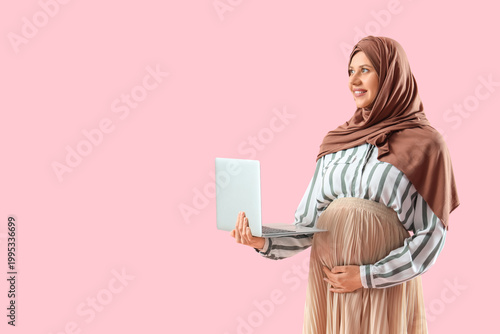Pregnant Muslim businesswom...