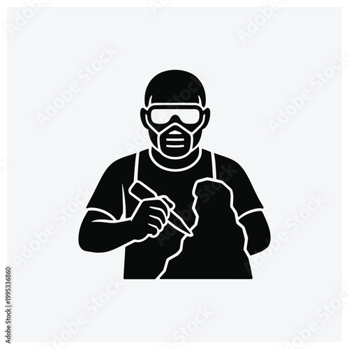 Silhouette of a creative masked artist or street performer holding a tool