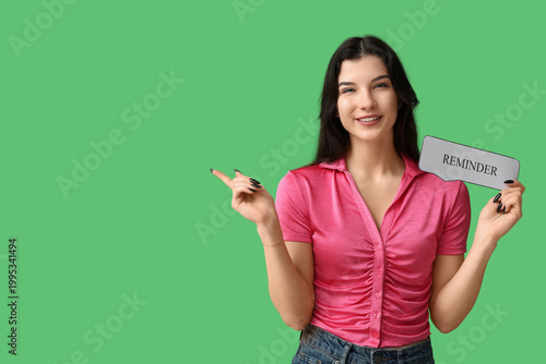 Pretty young woman holding ...