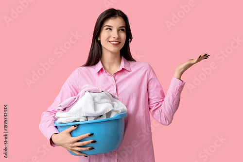 Young woman holding basket ...